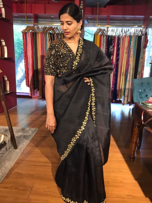 Black saree by Mirra clothing.