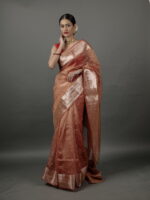 "Vibrant orange crushed tissue silk saree showcasing a soft, textured finish." By Mirra Clothing