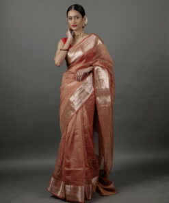 "Vibrant orange crushed tissue silk saree showcasing a soft, textured finish." By Mirra Clothing