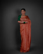 Full view of a model showcasing Orange Tissue Silk Saree , Well-suited for parties By Mirra Clothing