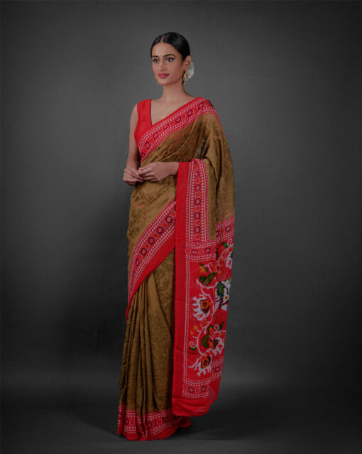 Side view of a model showcasing Moss Green Printed Georgette Saree with Chikankari Weaves , Suitable for pujas or religious gatherings By Mirra Clthing