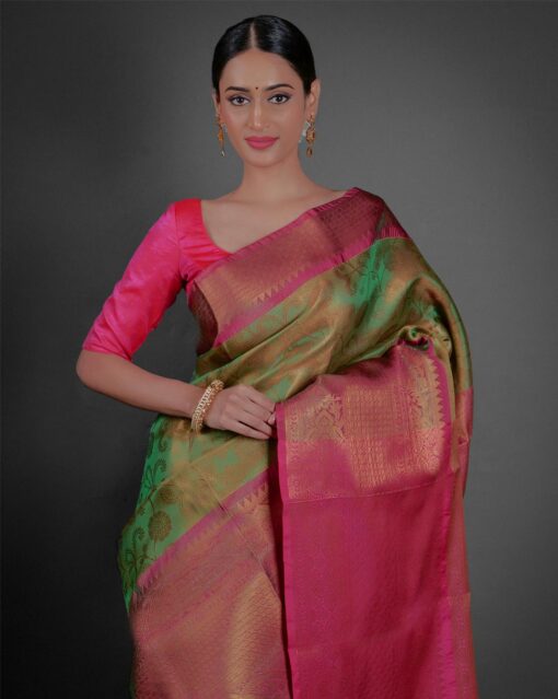 "Full view of a model showcasing Green Tissue Silk Saree With Contrast Border , Suited for cultural celebrations "By Mirra Clothing