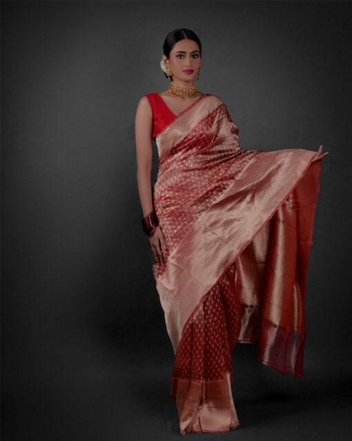 "Stylish tissue saree featuring a blend of vibrant hues and intricate patterns."by Mirra Clothing