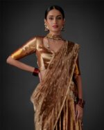 Front view of a model showcasing a Molten Gold Tissue Silk Half Saree Set with Dupatta and Blouse, Suitable for cultural festivities By Mirra Clothing