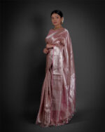 "Side view of a model showcasing Blush Pink Brocade Tissue Silk Saree , Made for trendy celebrations. "By Mirra Clothing