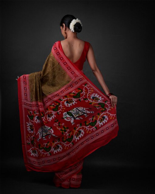 Back view of a model showcasing Moss Green Printed Georgette Saree with Chikankari Weaves , Ideal for pre-wedding celebrations By Mirra Clothing