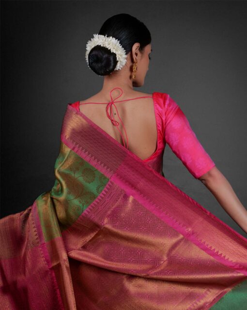 "Back view of a model showcasing Green Tissue Silk Saree With Contrast Border , Ready for festive gatherings "By Mirra Clothing