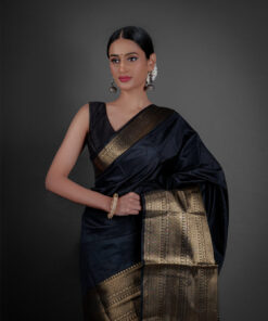 "A luxurious Banarasi saree in deep gold, adorned with intricate zari work and traditional perfect for festive occasions."by Mirra Clothing