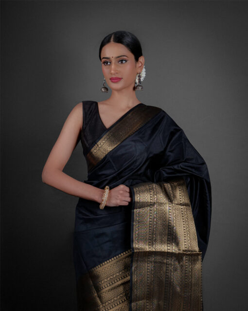 "A luxurious Banarasi saree in deep gold, adorned with intricate zari work and traditional perfect for festive occasions."by Mirra Clothing