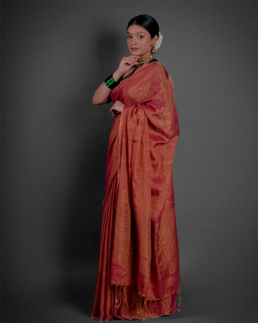 Side view of a model showcasing Ombre Red Tissue Linen Saree , Suitable for special ceremonies By Mirra Clothing