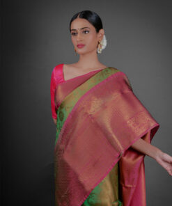 Close up view of a model showcasing Green Tissue Silk Saree With Contrast Border , Ideal for festivities By Mirra Clothing