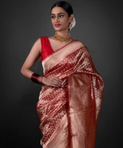 "Close-up of a luxurious red tissue saree showcasing Gold Buttis Saree By MirraClothing