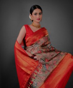 Close up view of a model showcasing Green Banarasi Silk Saree Highlighted with Kalamkari Prints , Suitable for traditional performances or fairs By Mirra Clothing