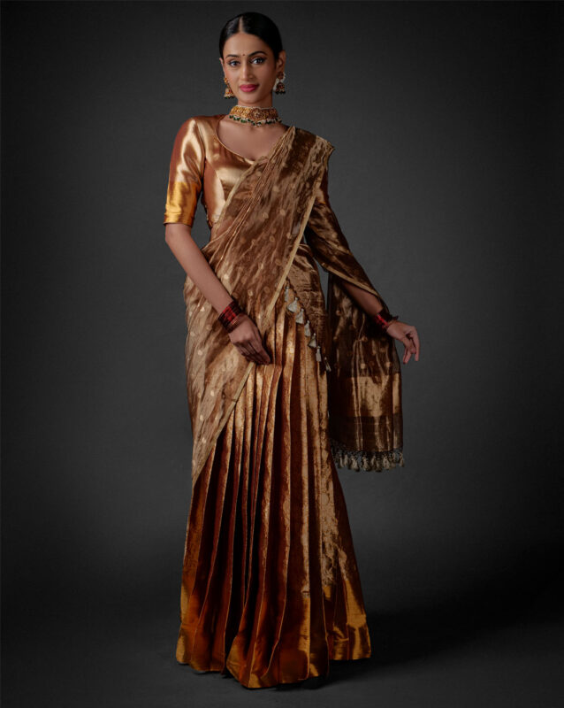 Full view of a model showcasing Molten Gold Tissue Silk Half Saree Set with Dupatta and Blouse, Suitable for special ceremonies By Mirra Clothing