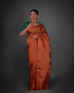 Full view of a model showcasing Copper Tissue Silk Saree with Self Design Border, Suitable for Appropriate gatherings By Mirra Clothing