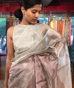 "Model posing in a beautiful ombre wine Tissue silk saree"By Mirra Clothing