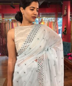 Front view of a model showcasing a Baby Blue Chiffon Silk Saree Embellished with Mirrors, An Excellent Option for Party Outfits By Mirra Clothing