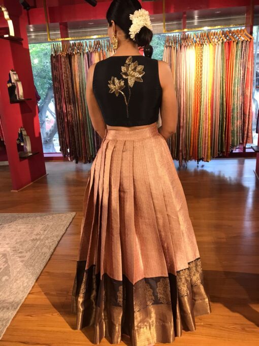 Back view of a model showcasing Dusty Pink Crop Top and Lehenga (Set of 2), perfect for festive occassions By Mirra Clothing