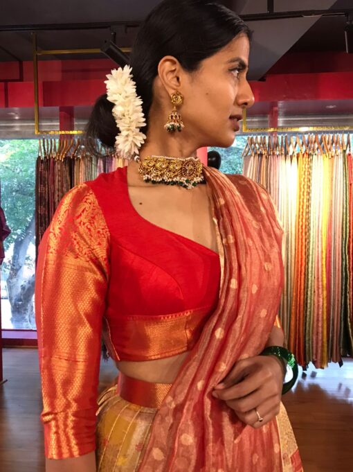 Side view of a model showcasing Yellow Semi Kanchi Silk Half Saree (Set of 3), Well-suited for Festive Gatherings By Mirra Clothing