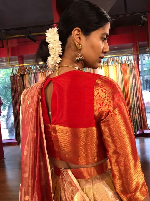 Back view of a model showcasing Yellow Semi Kanchi Silk Half Saree (Set of 3), Perfect for Celebratory Events By Mirra Clothing