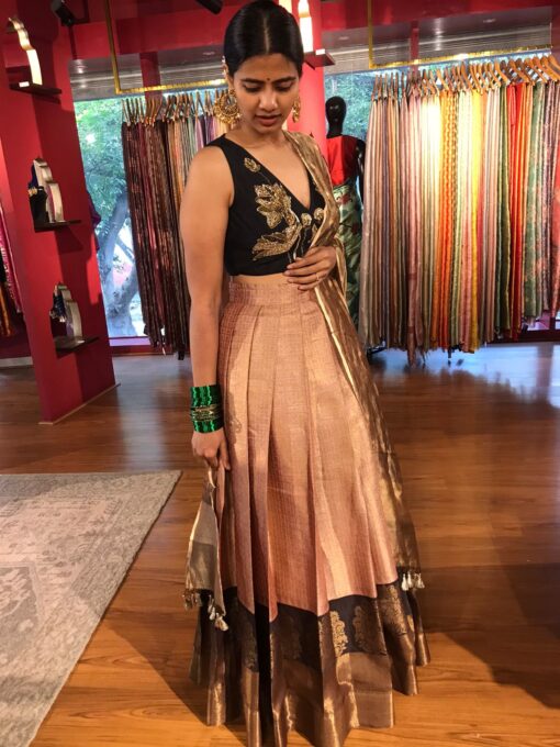 Side view of a model showcasing Dusty Pink Half Saree Silk Lehenga Set, Suitable for Festive wear By Mirra Clothing