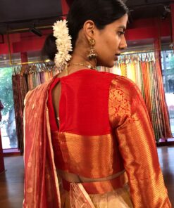 Back view of a model showcasing Yellow Semi Kanchi Silk Half Saree (Set of 2), Gorgeous lehenga for pre-wedding festivities By Mirra Clothing