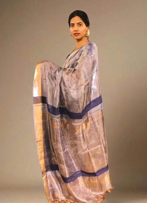 Side view of a model showcasing Blue Tissue Silk Saree, Ideal for pre-wedding celebrations By Mirra Clothing