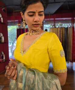 Side view of a model showcasing Lemon Yellow Silk Blouse, designed for elegance at any party. By Mirra Clothing