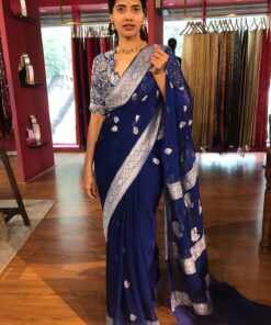 Side view of a model showcasing Blue Khaddi Banarasi Chiffon Silk Saree with Kadwa Zari Motifs, Ideal for Celebrations By Mirra Clothing