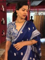 Close up view of a model showcasing Blue Khaddi Banarasi Chiffon Silk Saree with Kadwa Zari Motifs, Suitable for festive occasions By Mirra Clothing