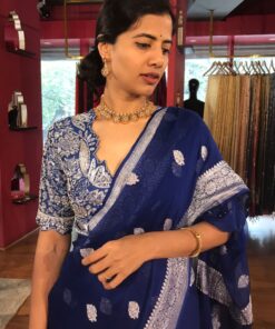 Close up view of a model showcasing Blue Khaddi Banarasi Chiffon Silk Saree with Kadwa Zari Motifs, Suitable for festive occasions By Mirra Clothing