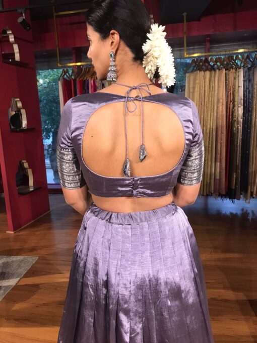 Back view of a model showcasing Lilac Silk Lehenga Set (Set of 2), Suitable for Muharatam By Mirra Clothing