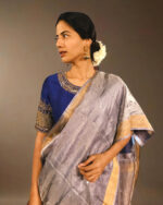 Close up view of a model showcasing Blue Tissue Silk Saree, Perfect for celebrating special occasions By Mirra Clothing