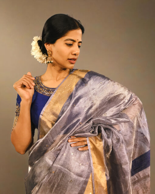 Close up view of a model showcasing Blue Tissue Silk Saree, designed for elegance at any party By Mirra Clothing